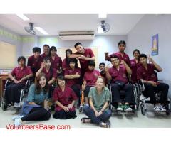 Volunteer teacher with children and students with disabilities