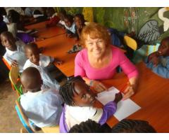 Volunteer with  children in Uganda