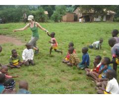 Volunteer with  children in Uganda